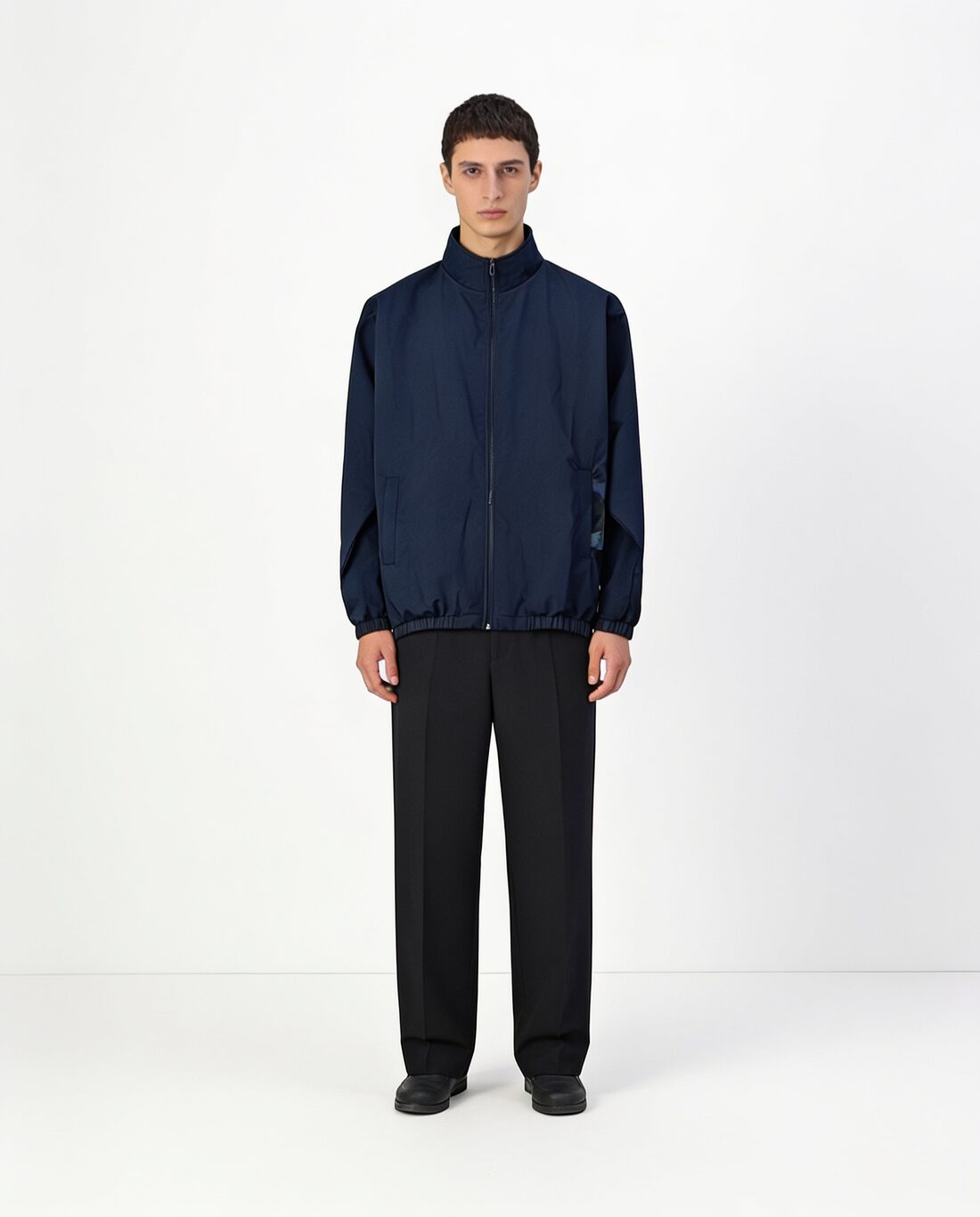 The same model with the bomber jacket in navy blue